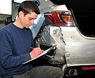 Insurance agent inspecting a car damage