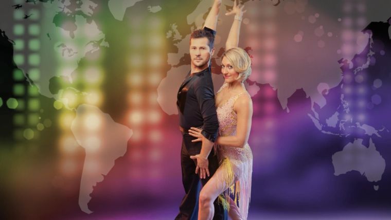 A man and a woman are dancing in front of a map of the world.