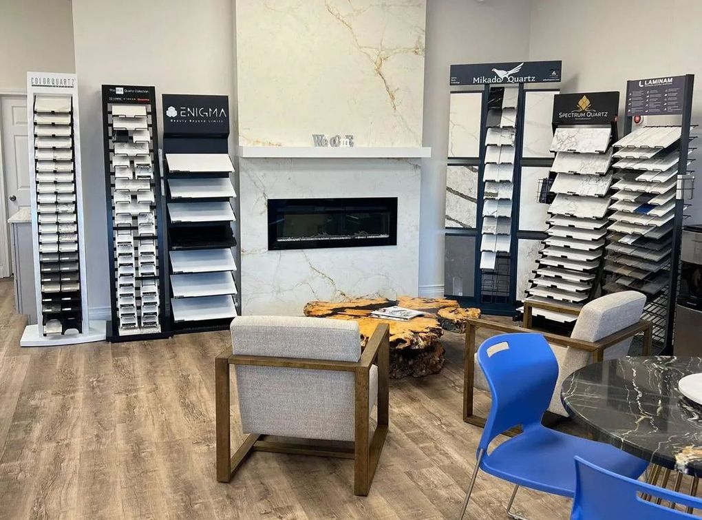 Tile showroom with displays, a fireplace, and seating.