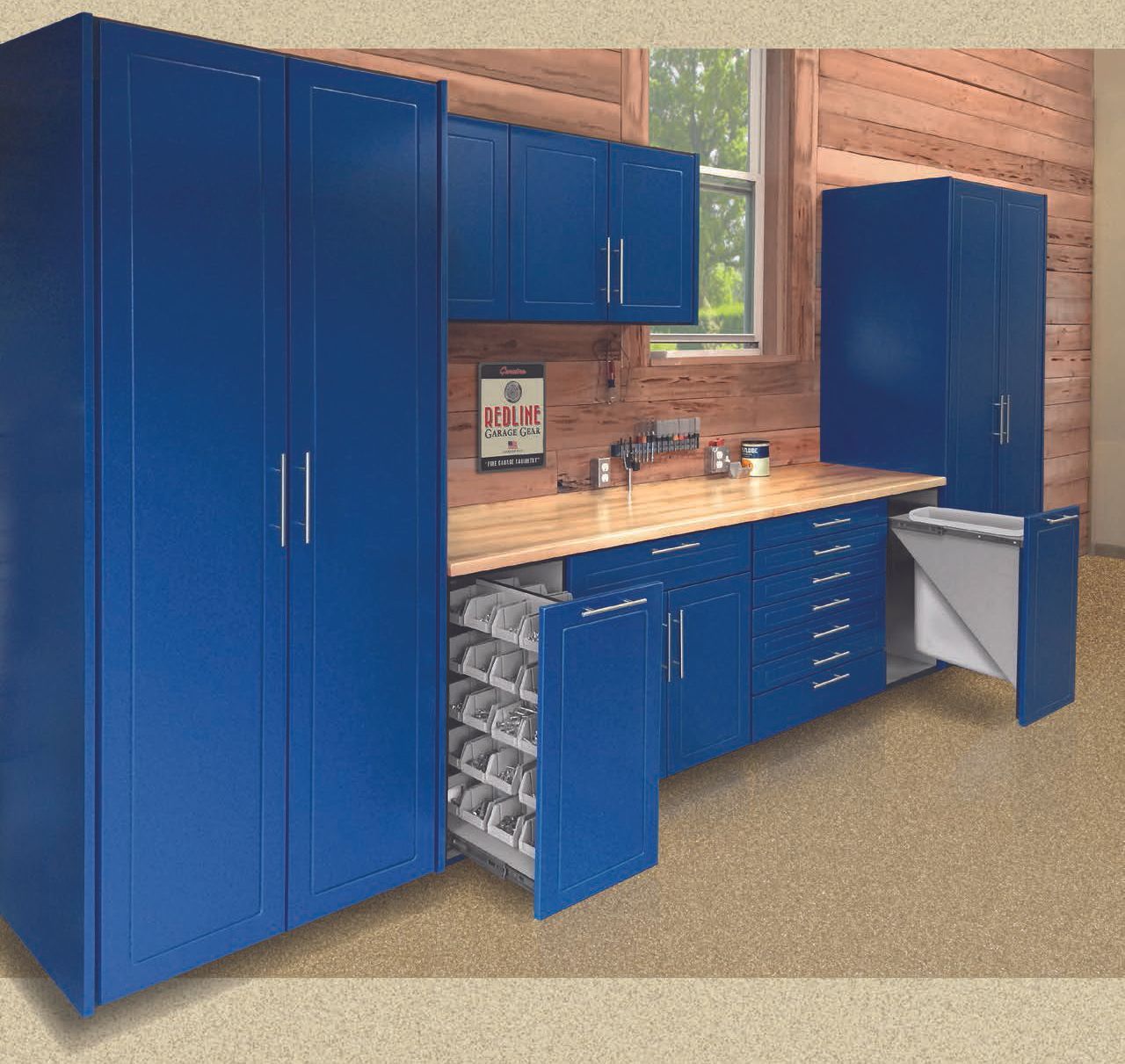 Blue cabinets and workbench in a workshop room with open storage and a window