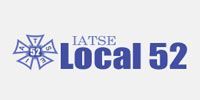 A logo for iatse local 52 with a cross on a white background.