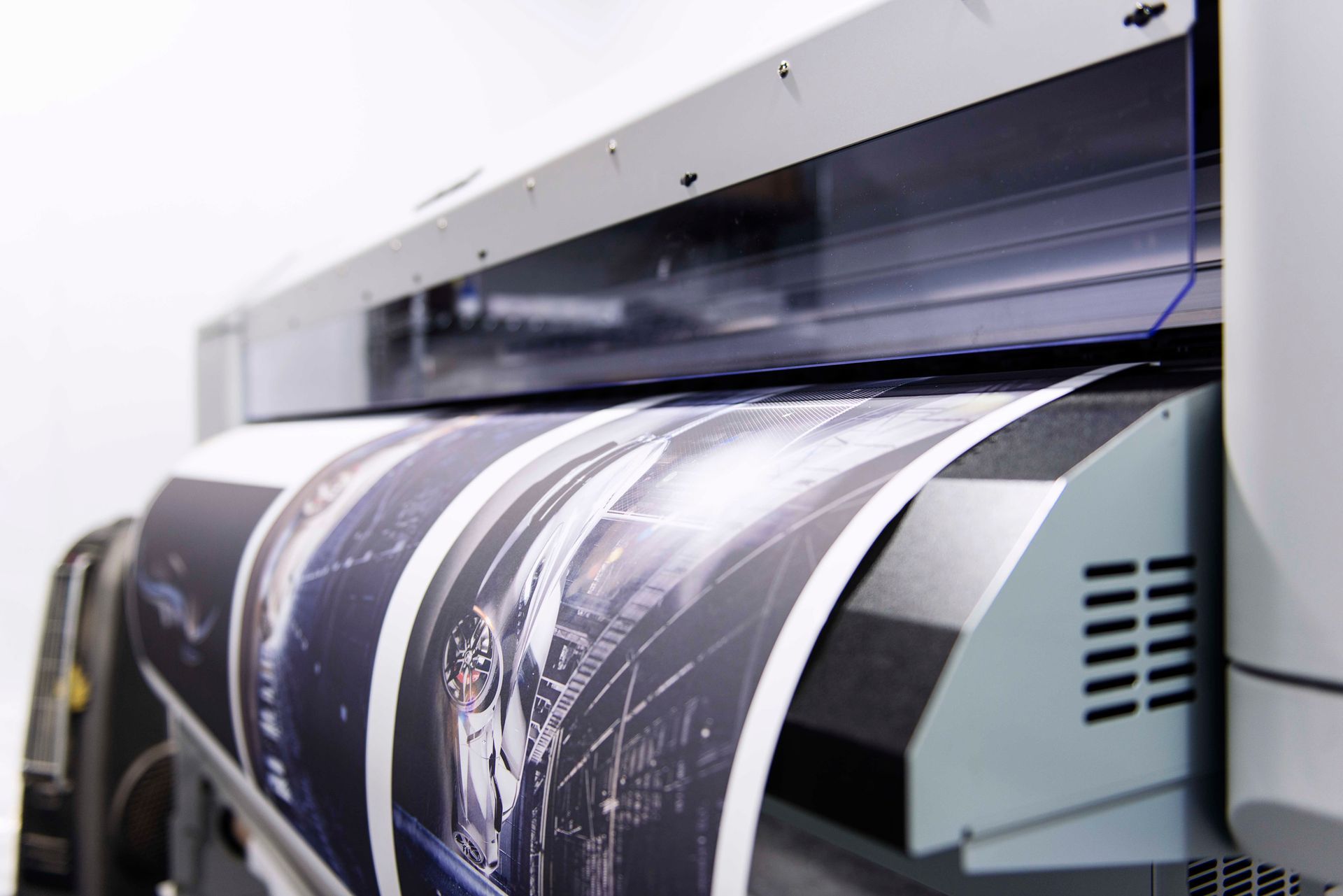 Large format printer printing a long, colorful image.