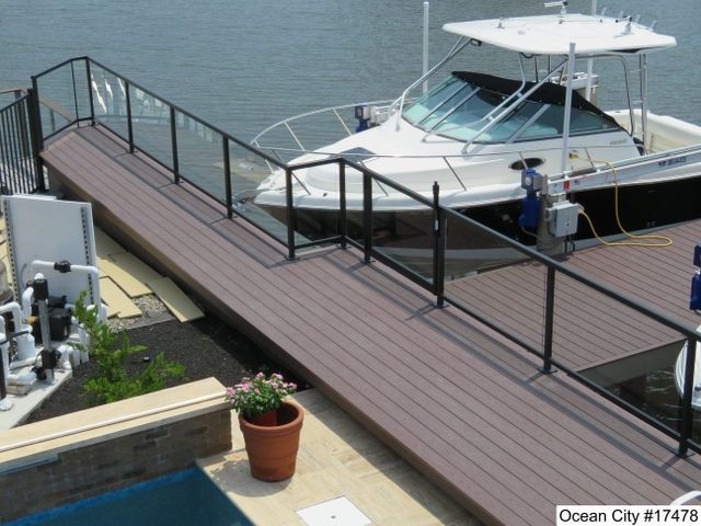 A boat is docked at a dock in ocean city new jersey