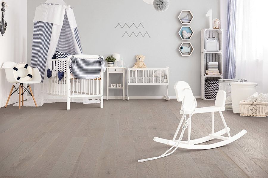 There is a rocking horse in the middle of the room.