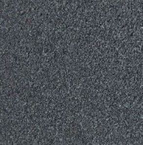 Gray, granular textured surface, likely asphalt or stone.