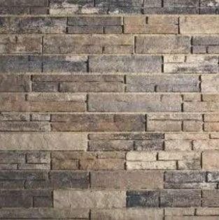 Stone wall with rectangular, layered bricks in shades of brown and gray.