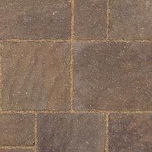 Brown rectangular pavers with sandy joints.
