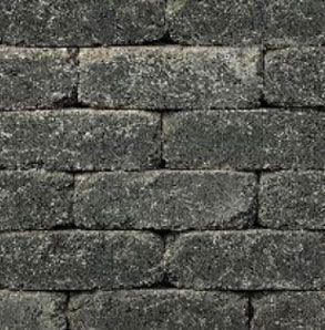 Dark gray brick wall with rough texture.