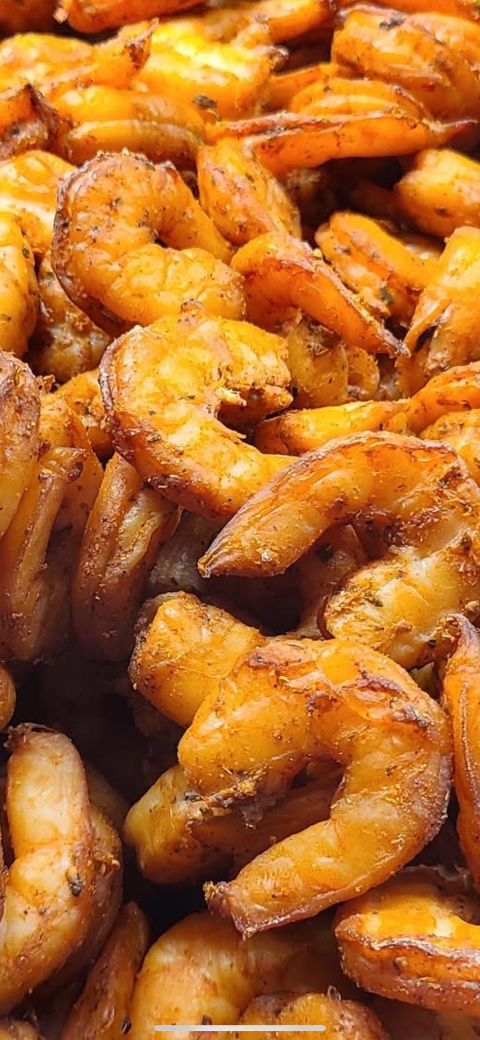 Golden, seasoned shrimp up close.