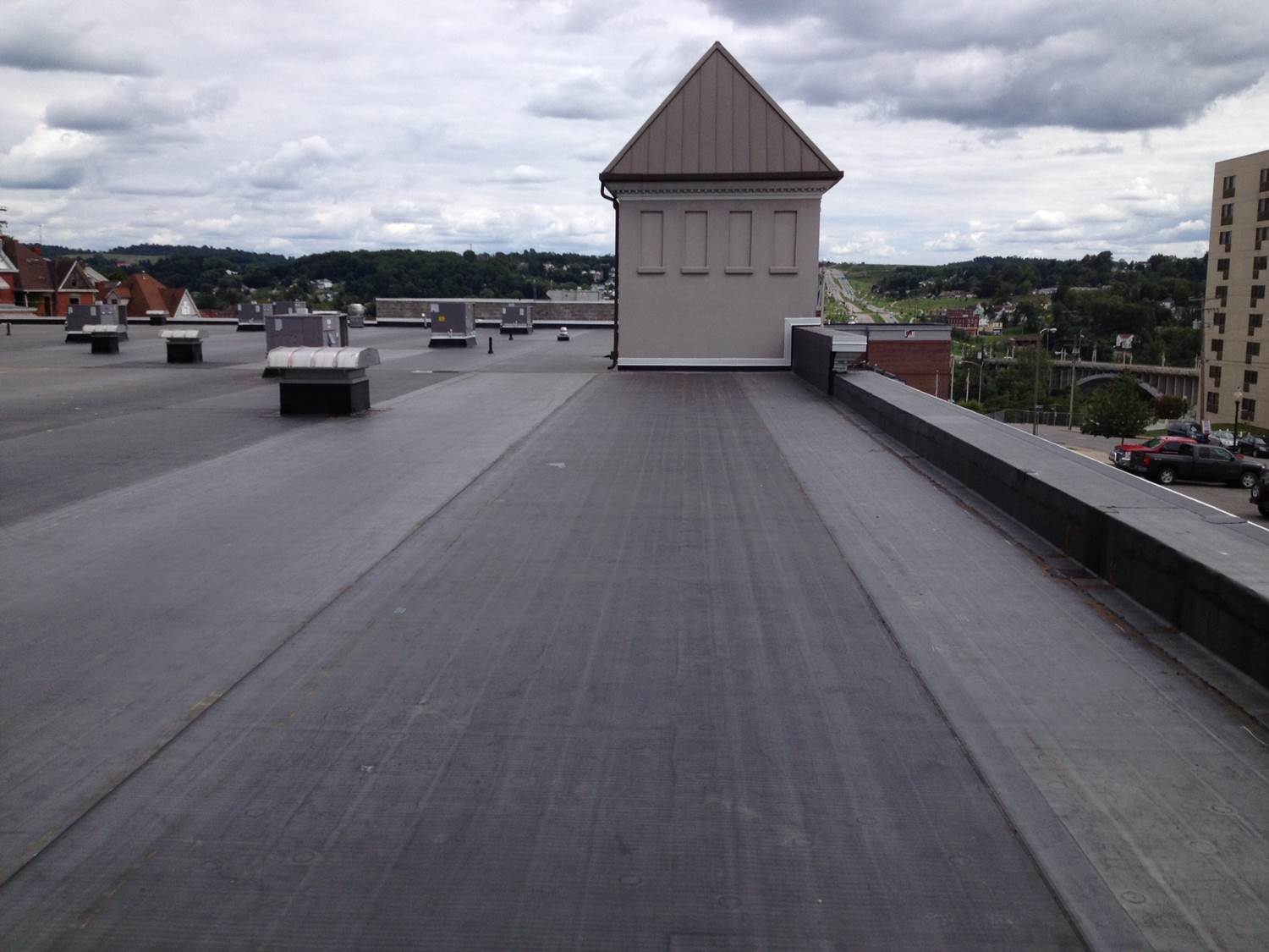 The roof of a building with a tower on top of it