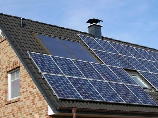 A brick house with solar panels on the roof