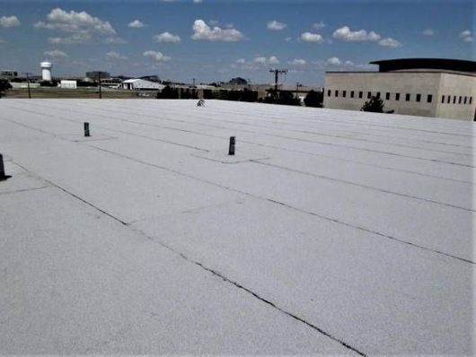 A white roof with a blue sky in the background