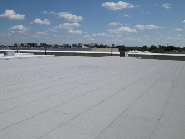 A white roof with a blue sky in the background