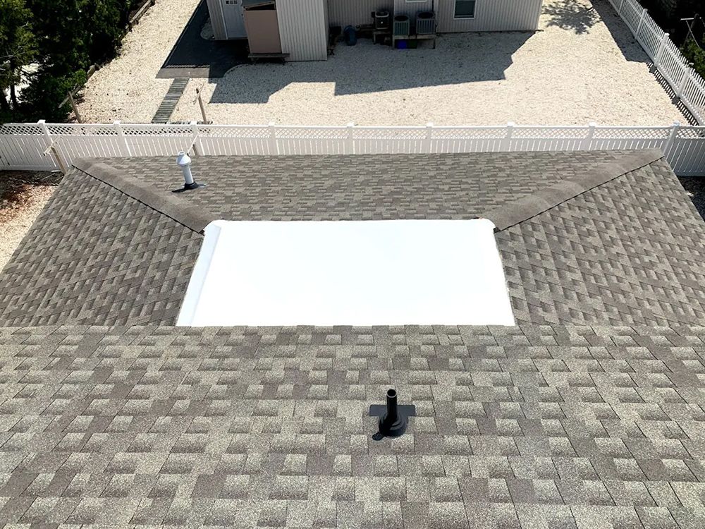 An aerial view of a roof with a hole in it.
