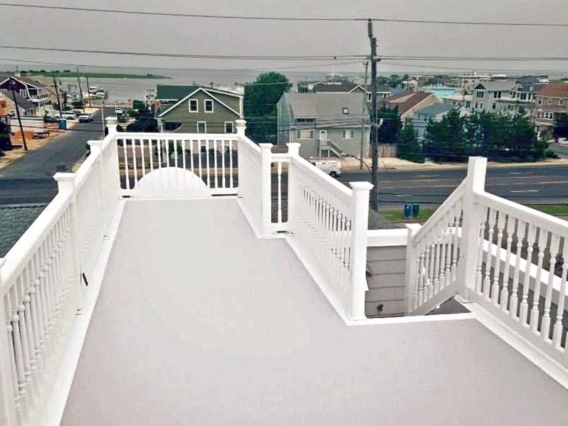 A white deck with a view of a city