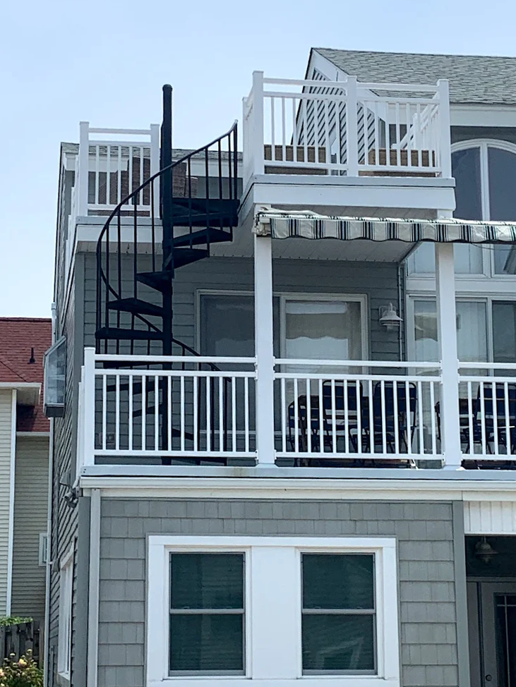 A house with a spiral staircase on top of it