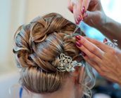 A bride at hairdressing salon before wedding