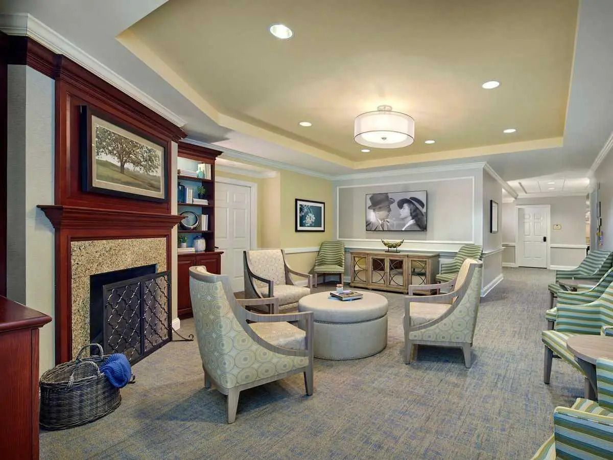 A living room filled with furniture and a fireplace.