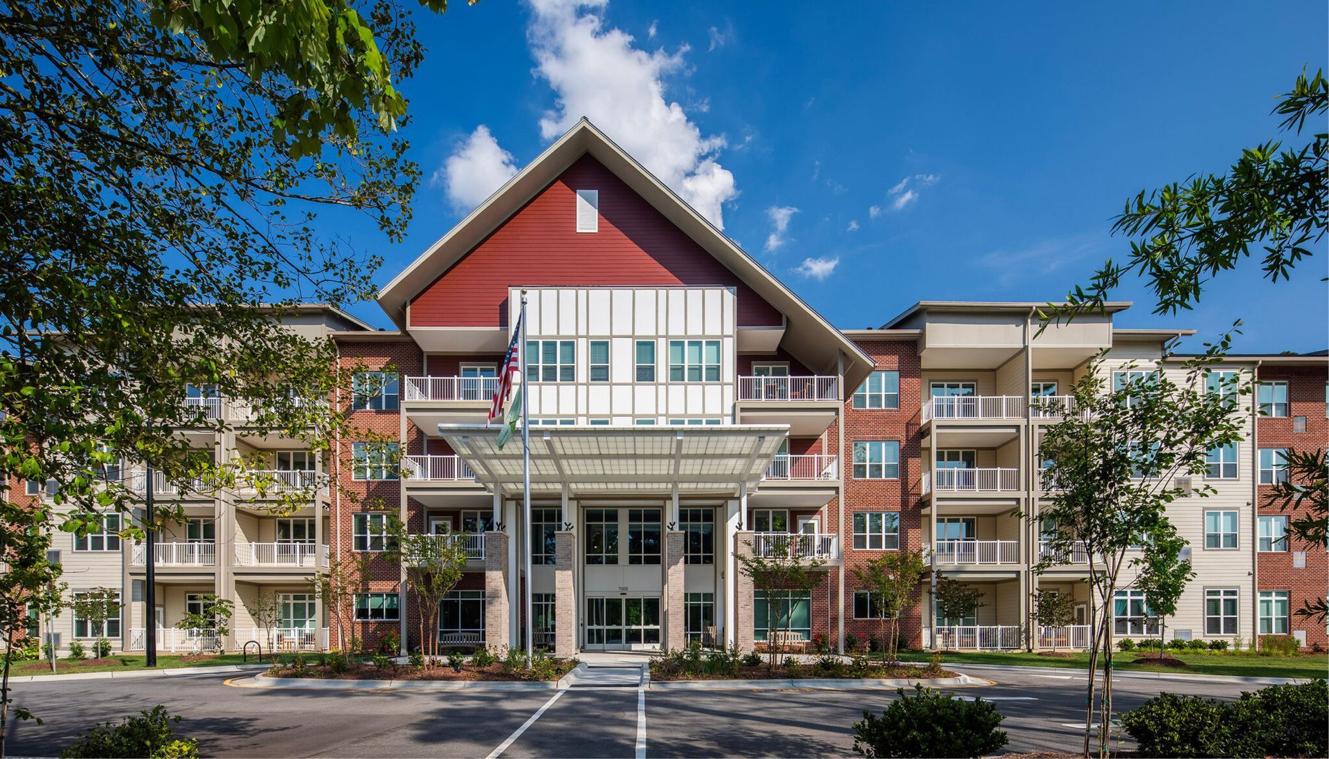 A large apartment building with a lot of windows and balconies.