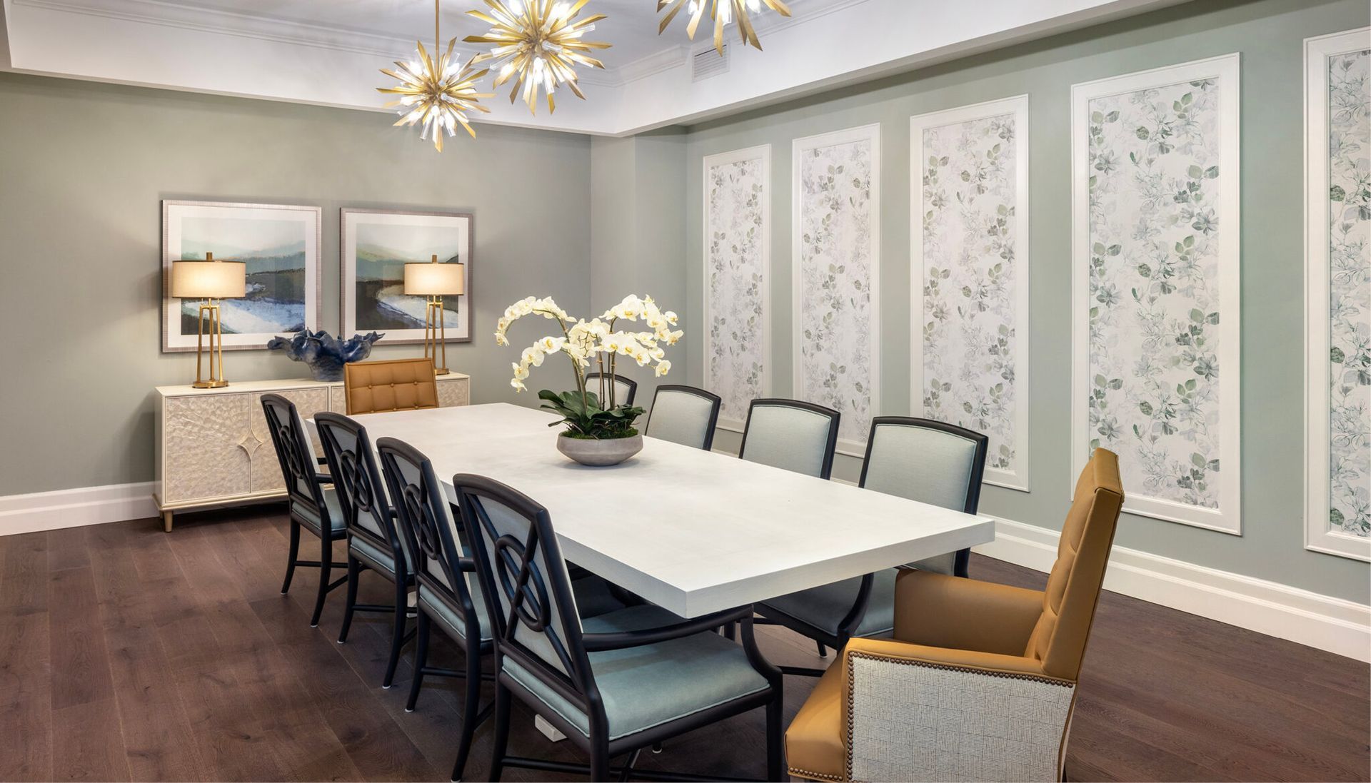 A large dining room with a long table and chairs.