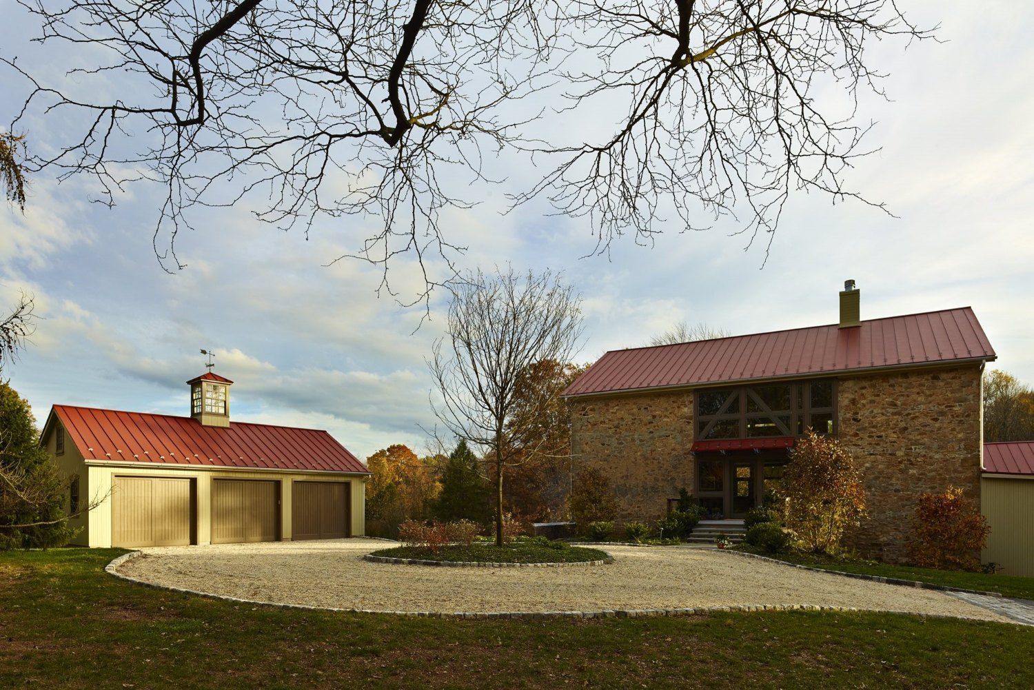 A house with a red roof and a garage