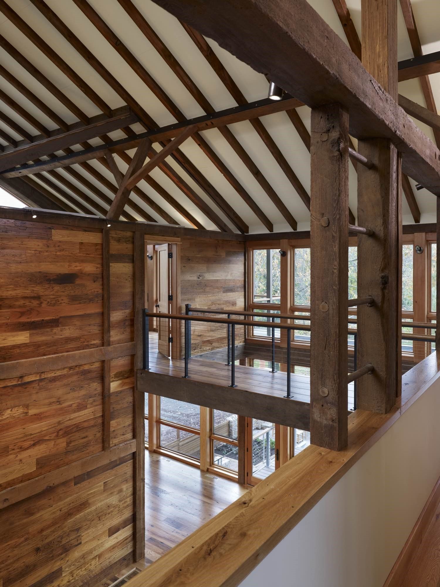 The inside of a building with wooden walls and ceilings