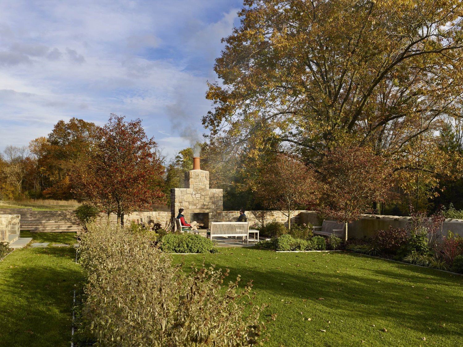 There is a fireplace in the middle of the garden.