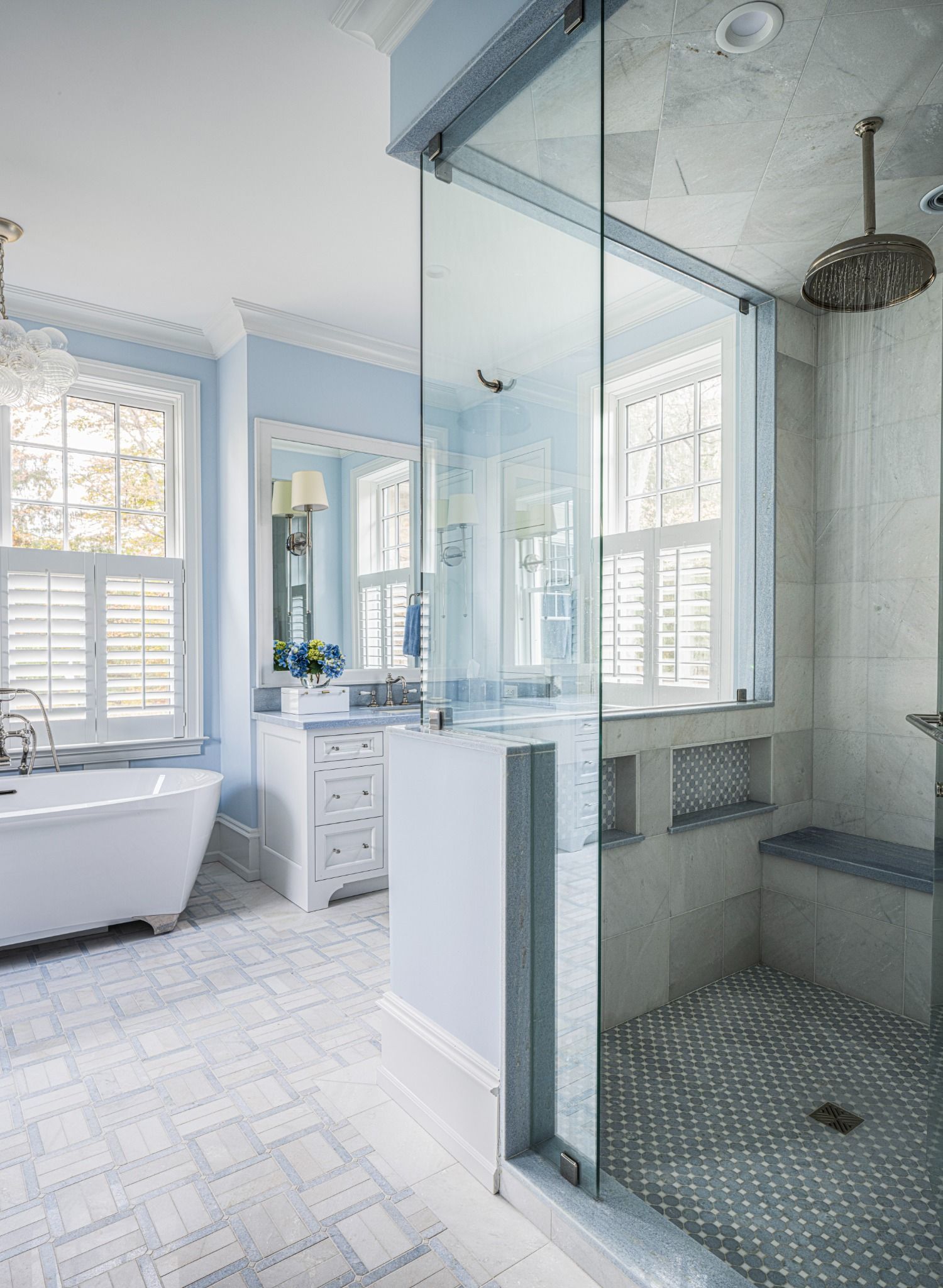 A bathroom with a walk in shower and a bathtub.