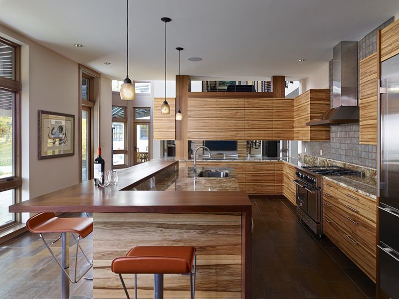 A kitchen with wooden cabinets and stainless steel appliances