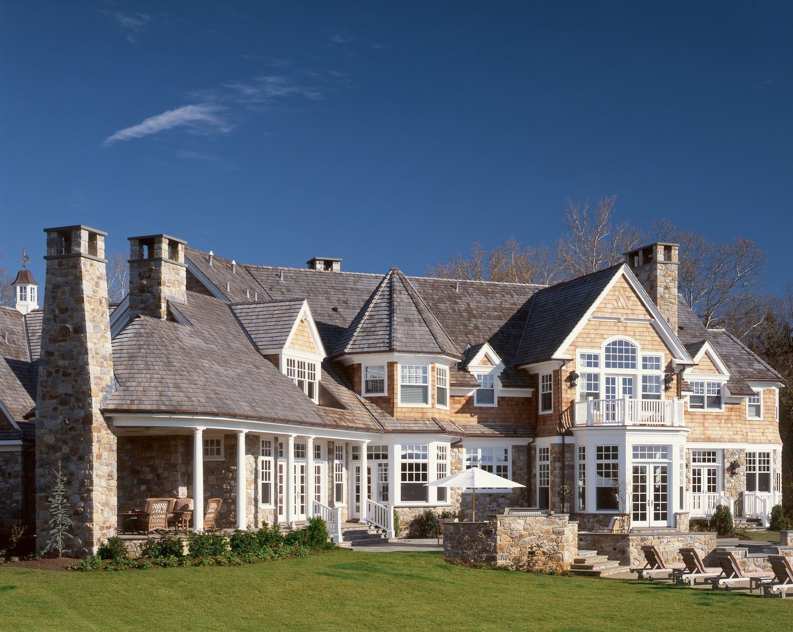 A large house with a large lawn in front of it