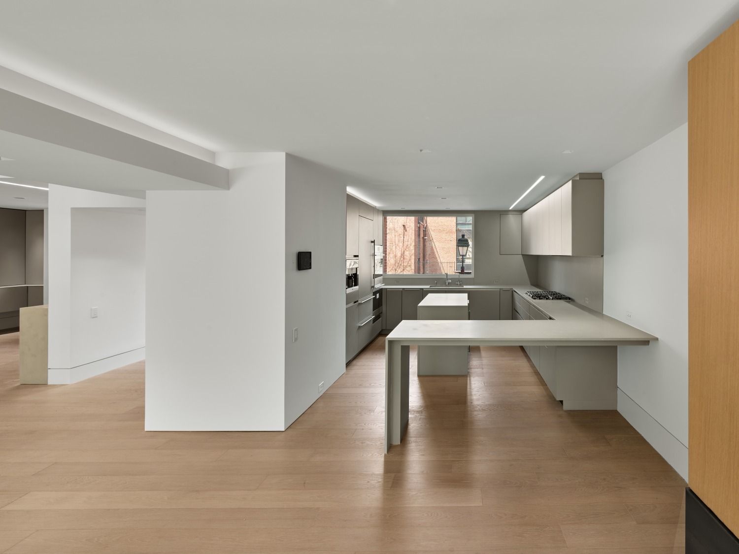 A kitchen with a table in the middle of it