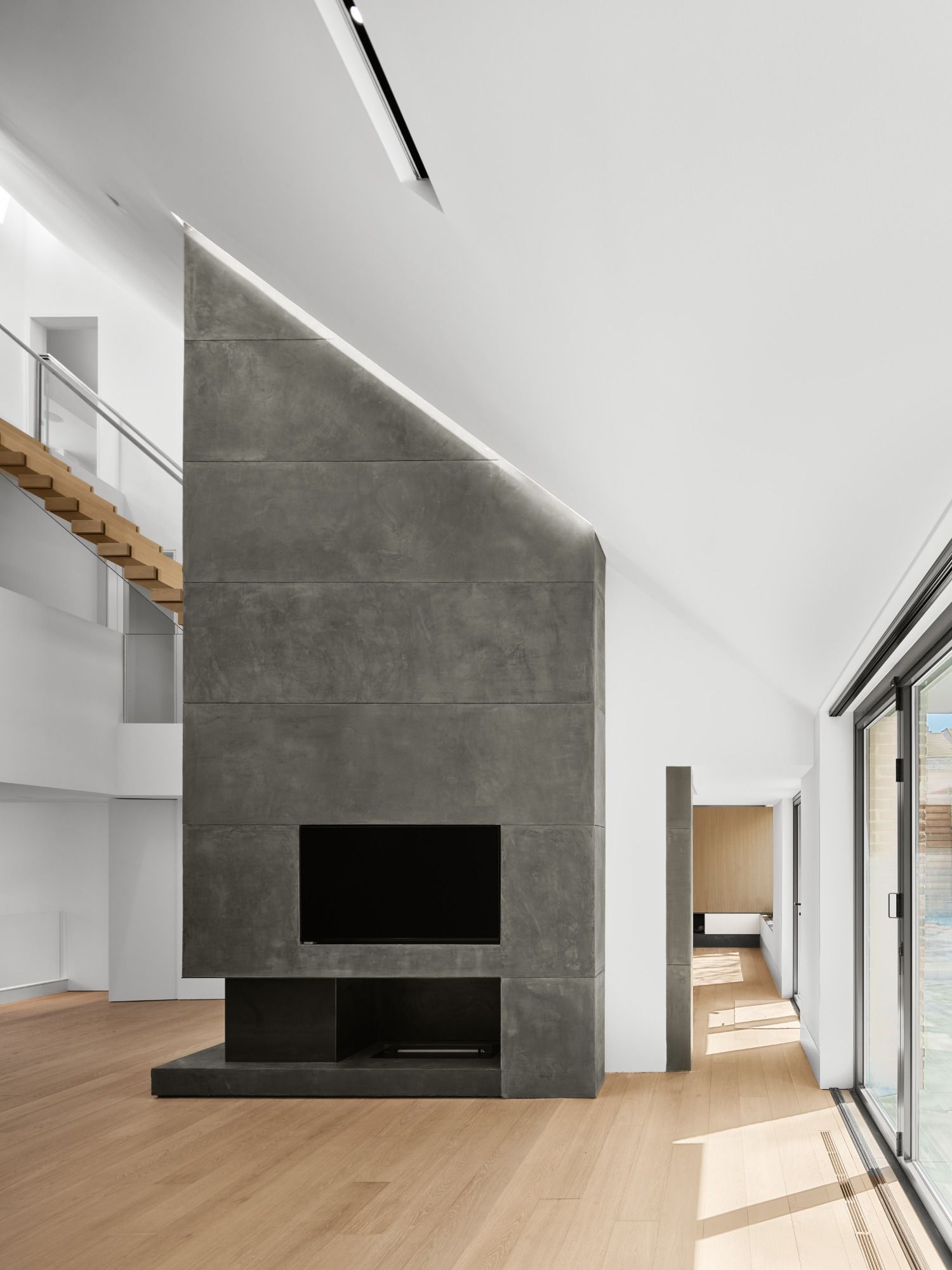 A living room with a fireplace and a flat screen tv.