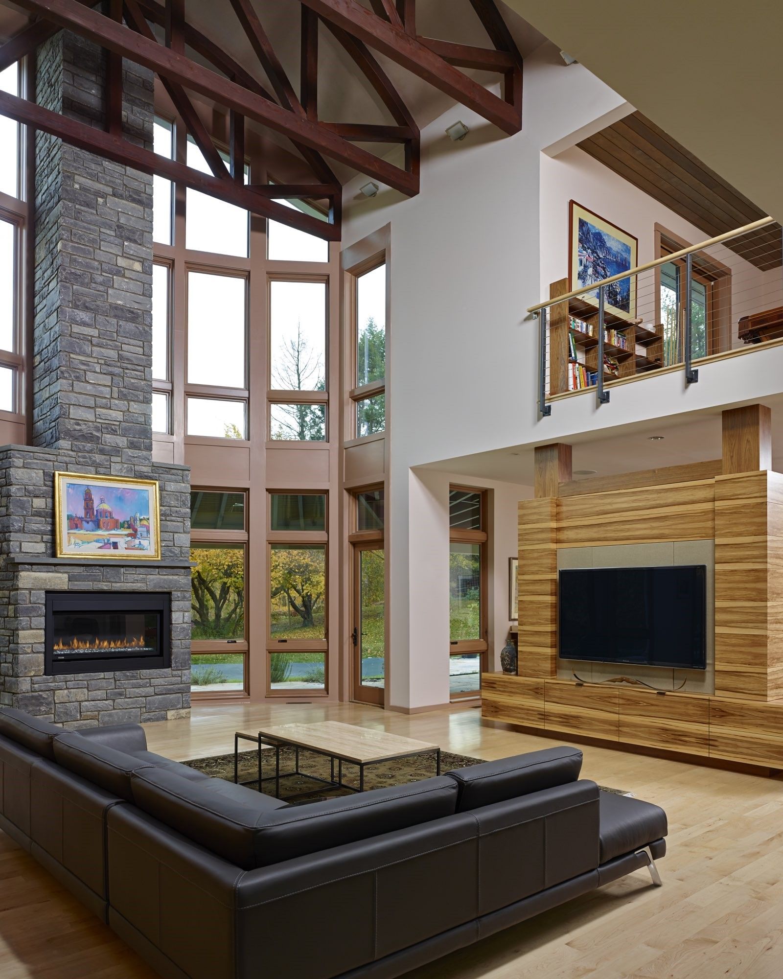 A living room with a couch a fireplace and a flat screen tv