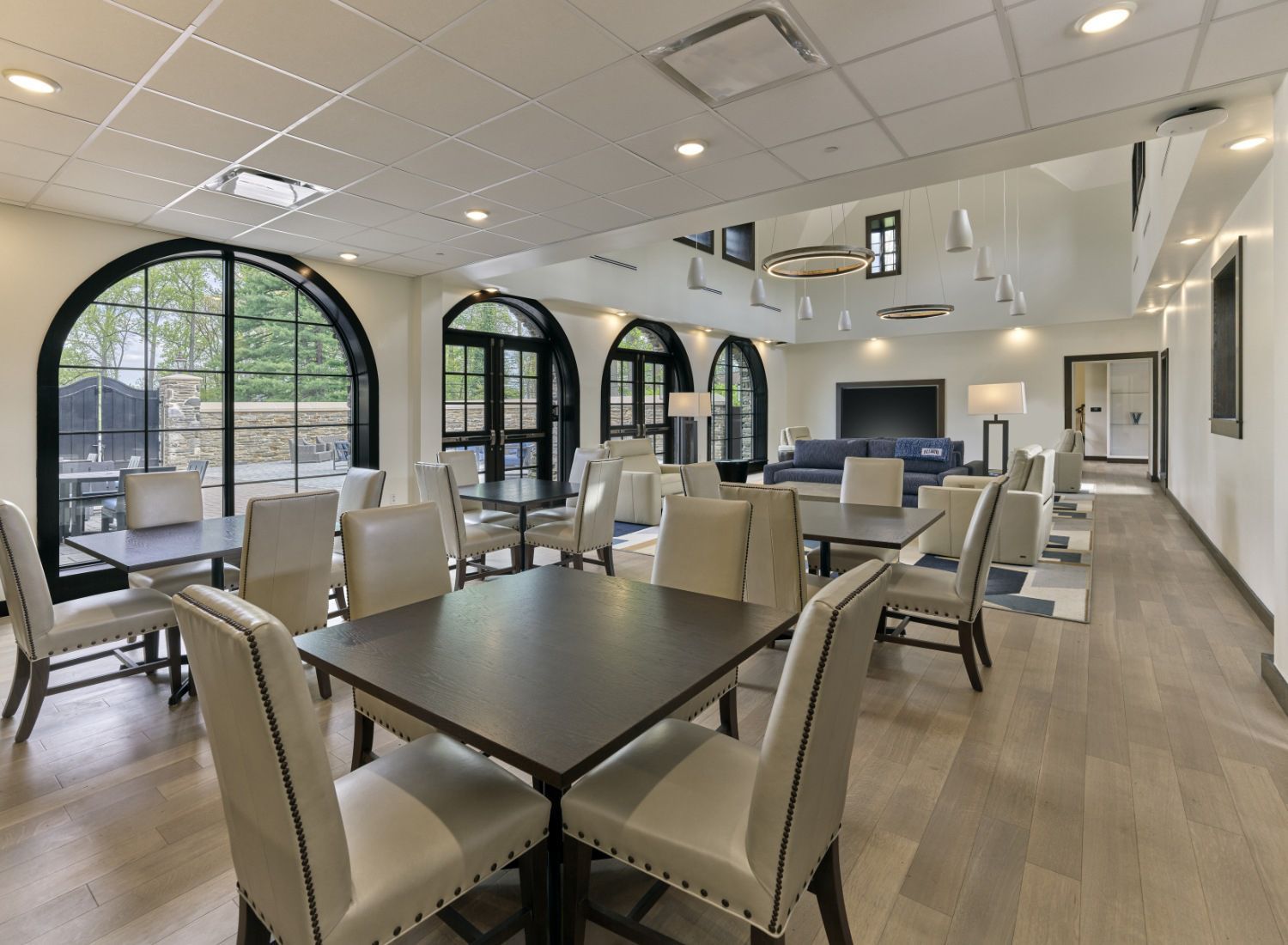 A large room with tables and chairs in it