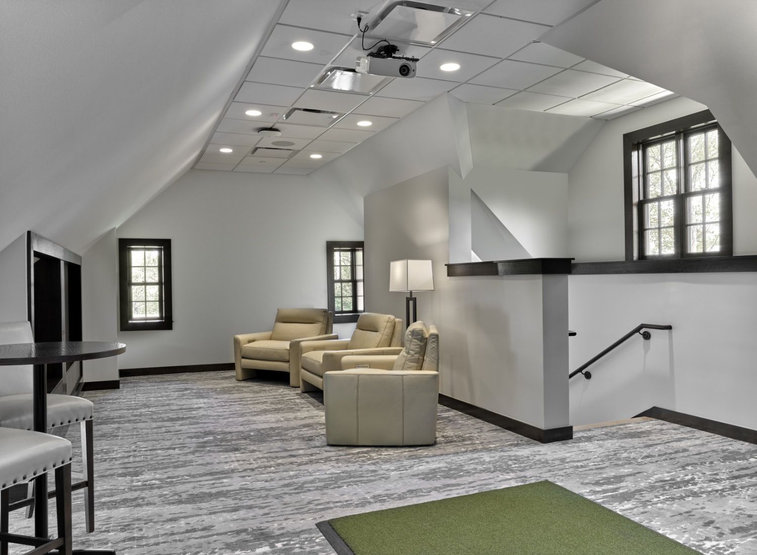 A living room with two chairs and a table