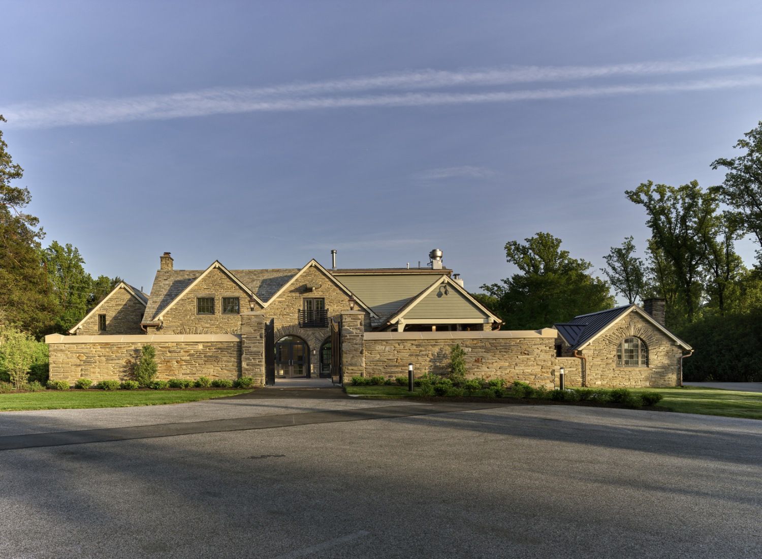 A large house with a driveway leading to it