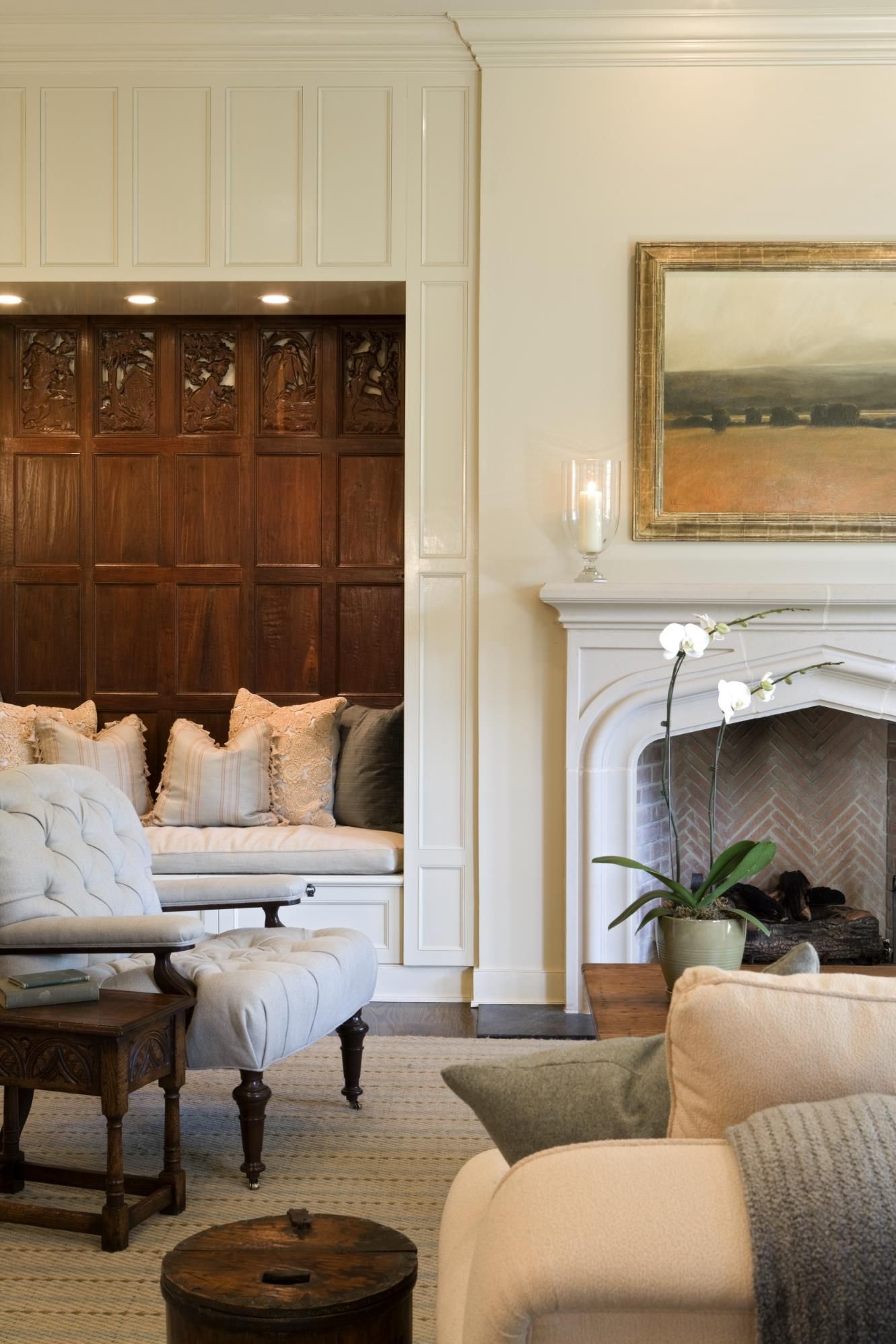 There is a fireplace in the middle of the living room.