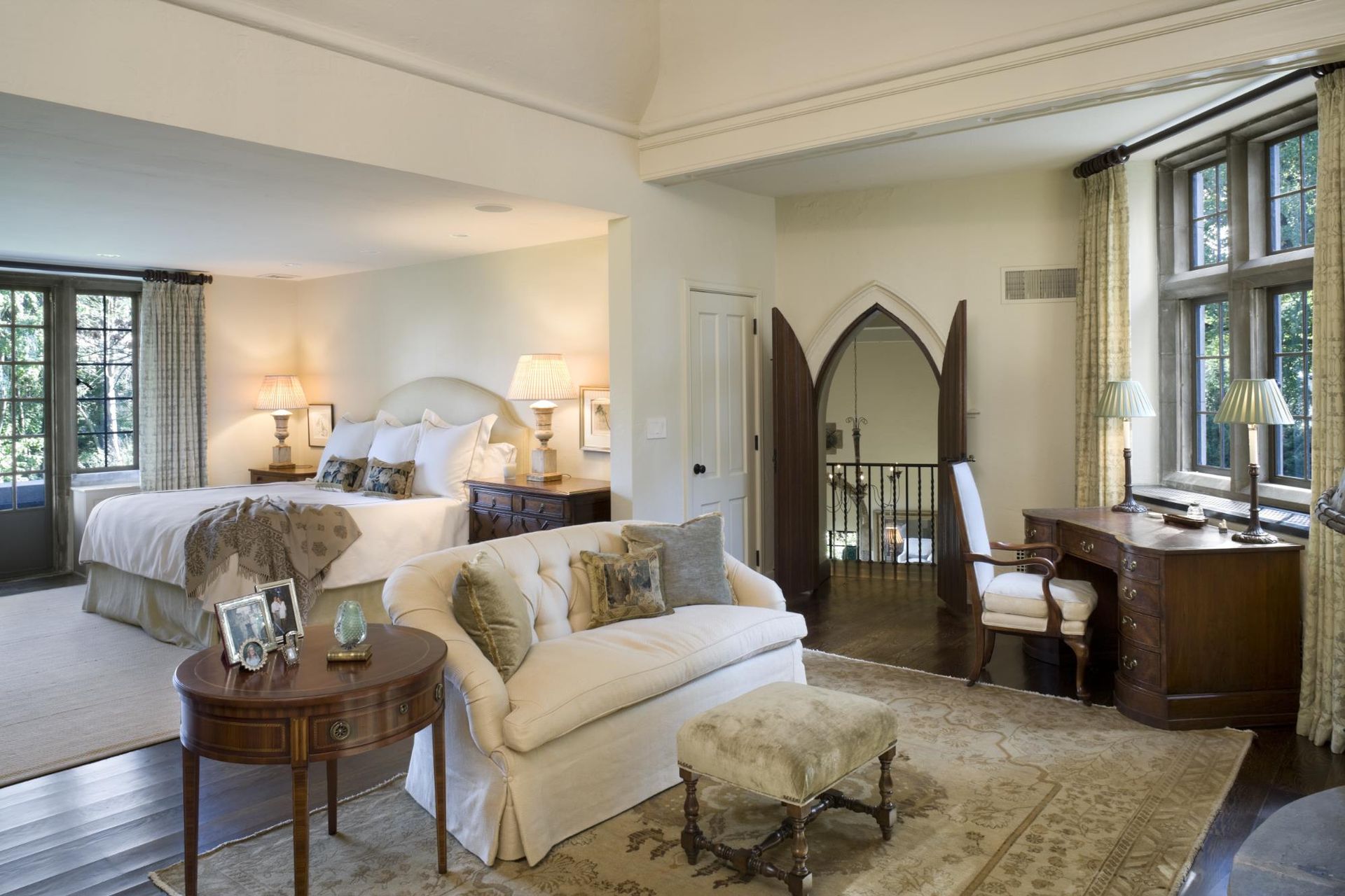 A bedroom with a large bed and a couch