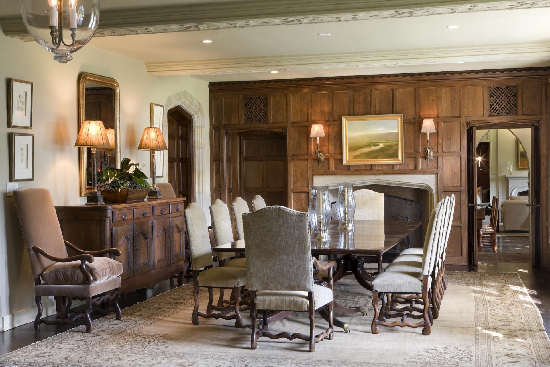 A dining room with a long table and chairs