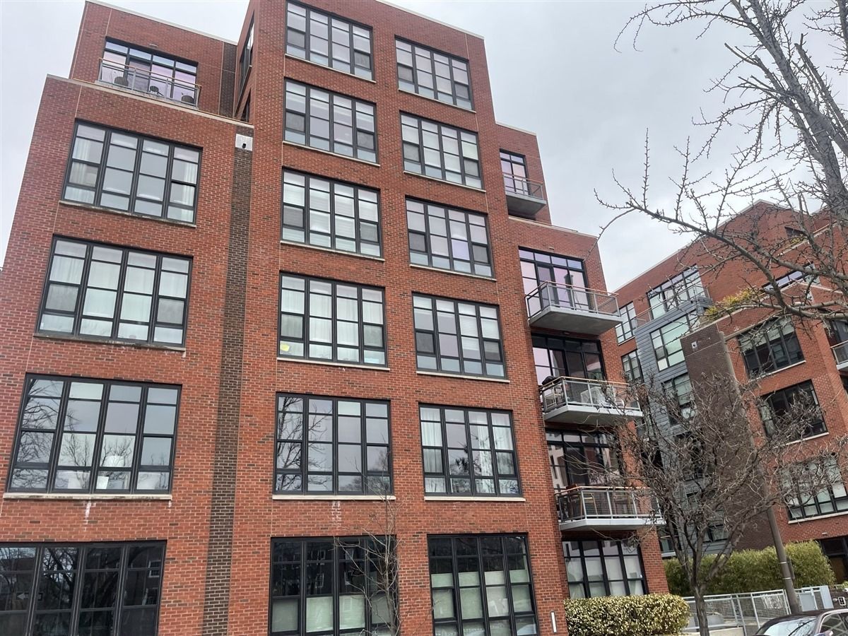 A large brick building with a lot of windows