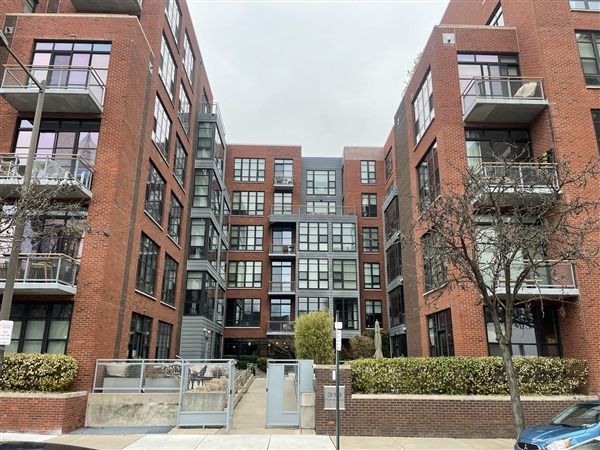 A large brick building with lots of windows and balconies