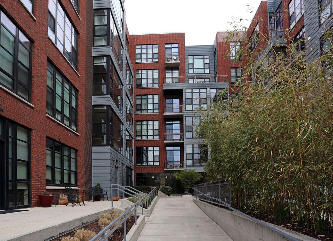 A brick building with a walkway leading to it