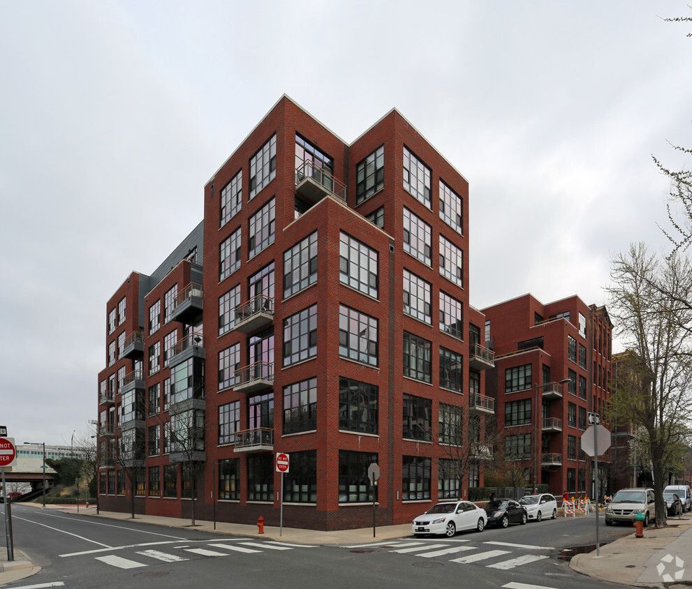 A large red brick building with a lot of windows
