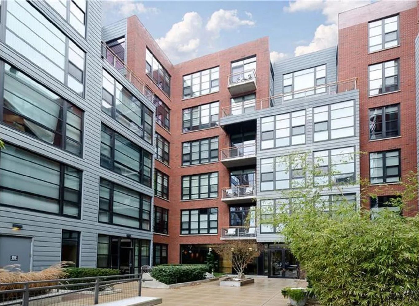 A large apartment building with a lot of windows