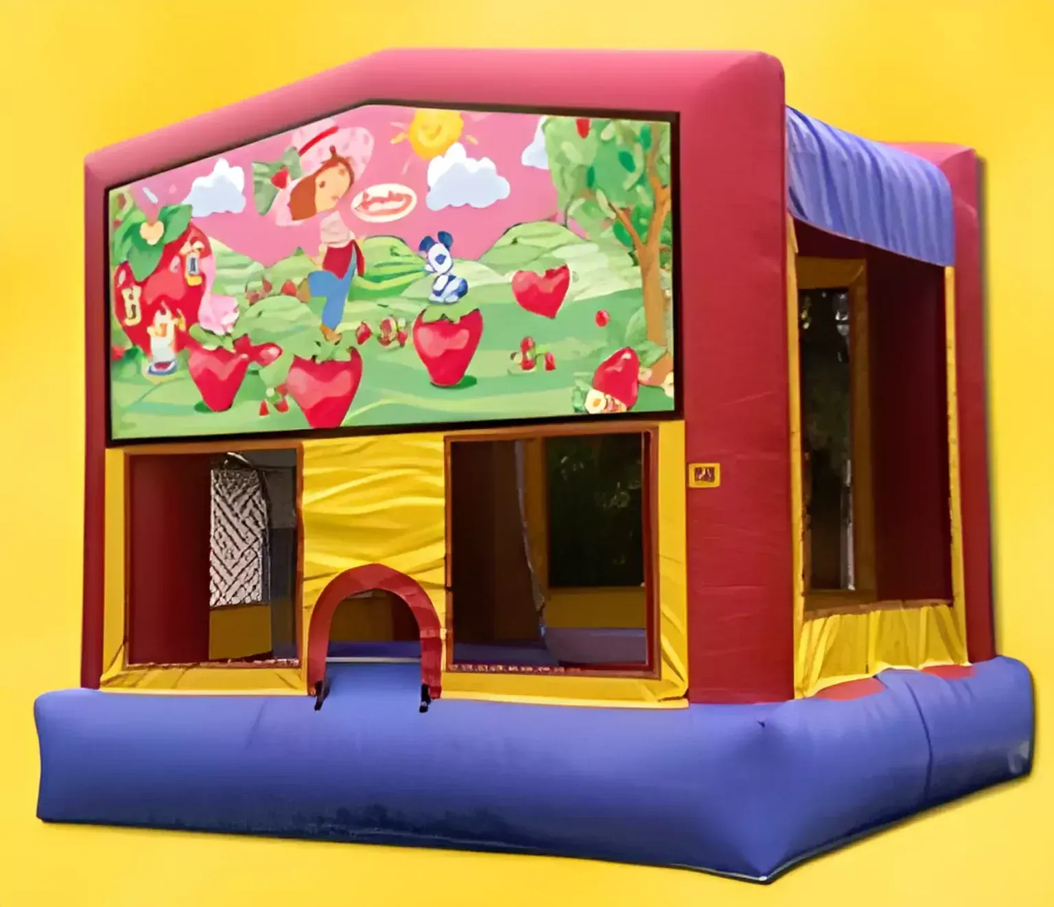 A bouncy house with a picture of strawberries on it