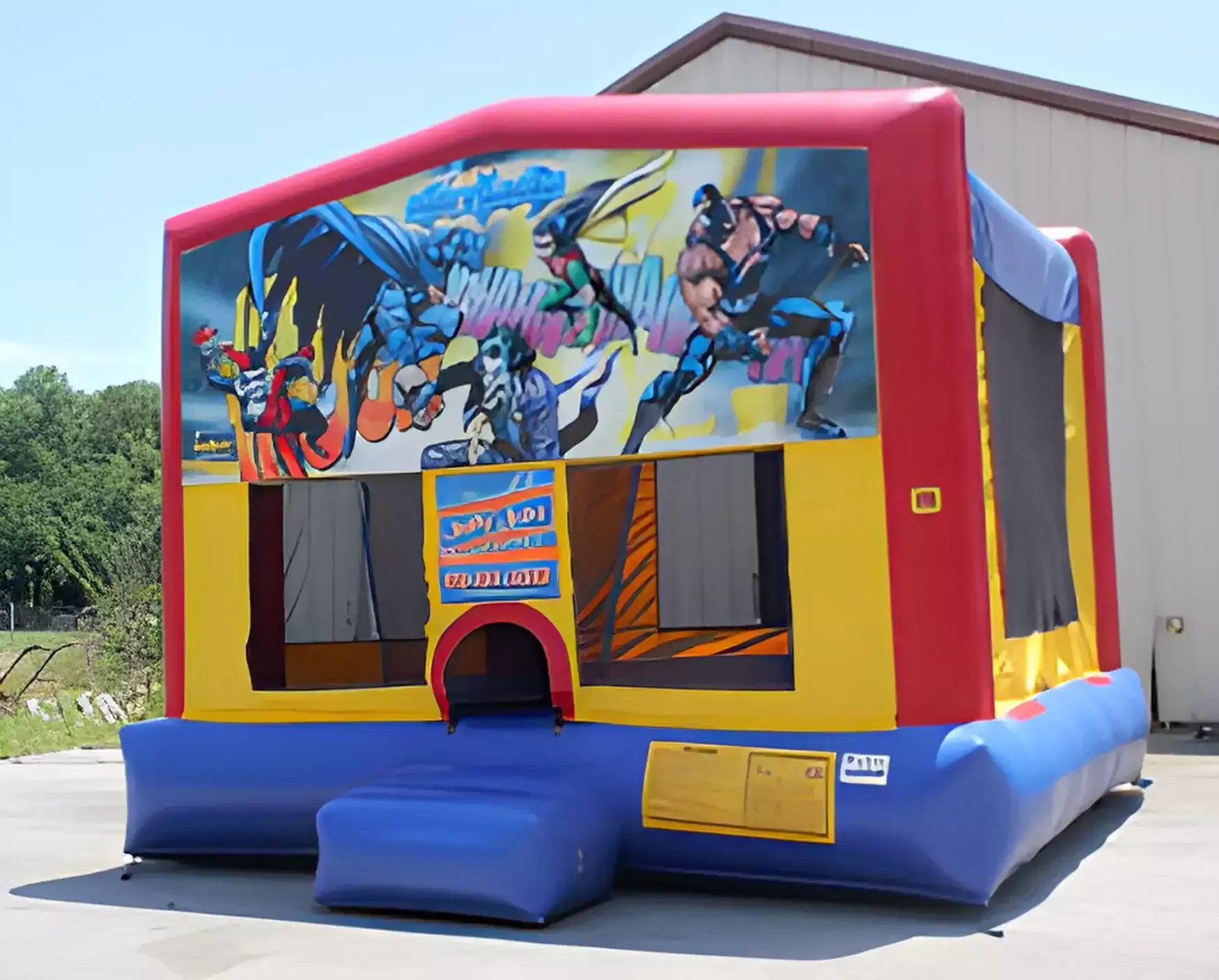 A bouncy house with a picture of batman and robin on it