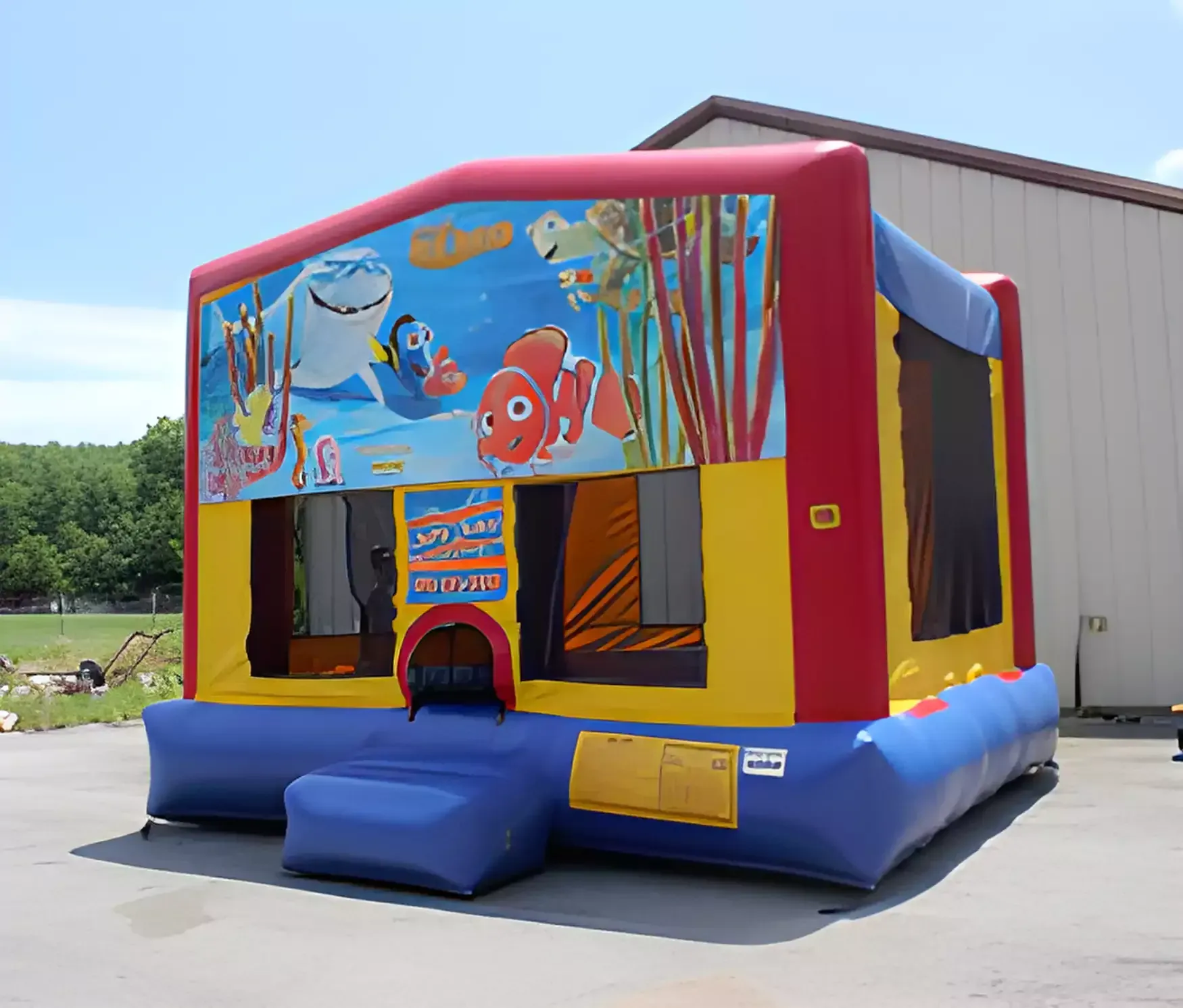 A bouncy house with finding nemo on it