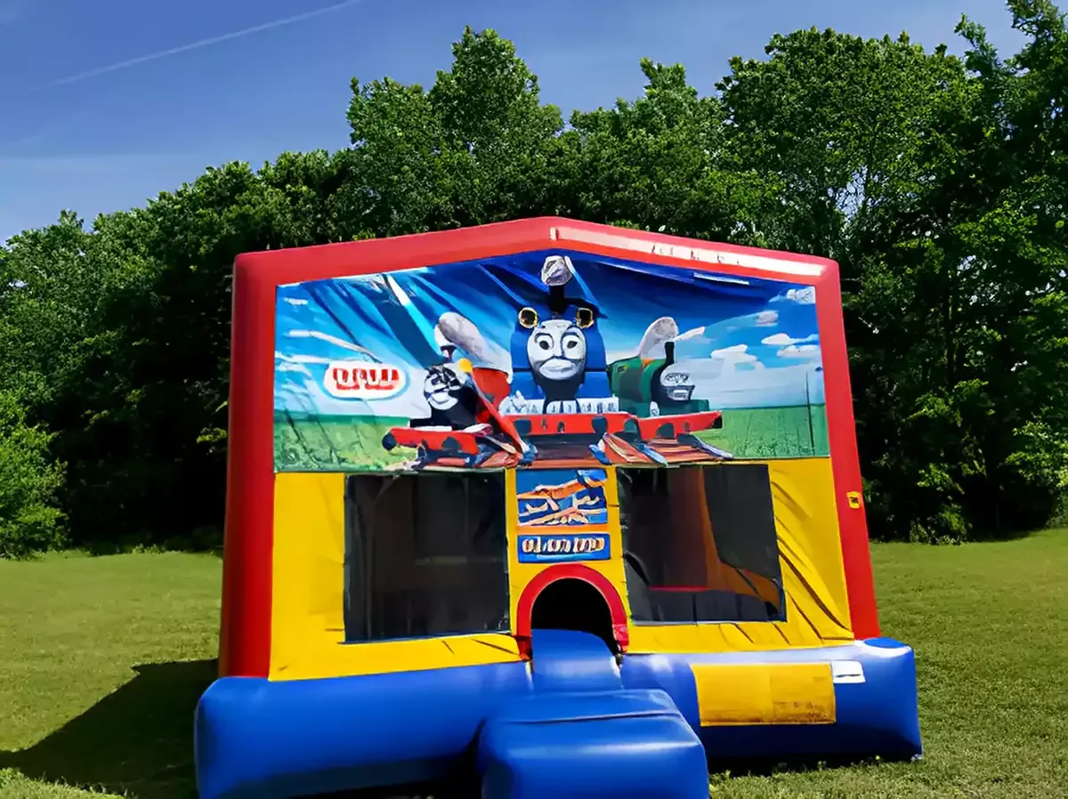 A bouncy house with a picture of thomas the train on it.