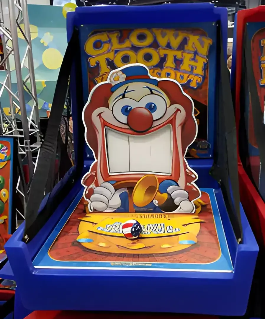 A clown tooth knockout game is sitting on a table