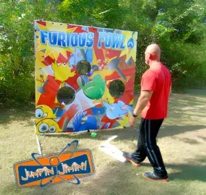 A man is playing a game called furious bowl